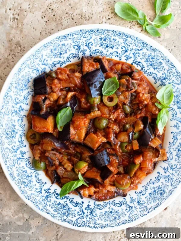 Sicilian caponata in a blue patterned bowl.