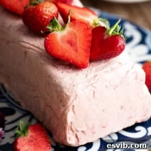 A close up of strawberry semifreddo topped with fresh cut strawberries.