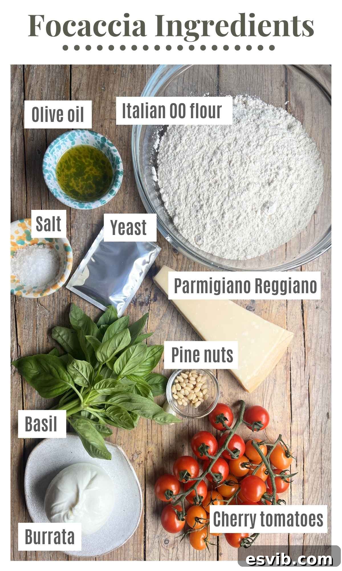 Ingredients laid out on a rustic wooden surface to make a focaccia with cherry tomatoes, basil pesto and burrata.