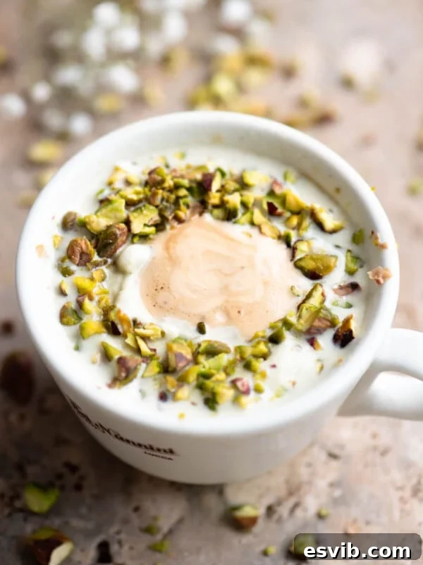 A pistachio affogato topped with chopped pistachios.