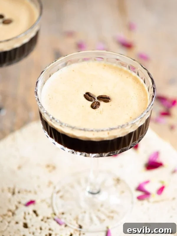 Caffe Shakerato: Classic Italian Iced Coffee Recipe 5 An espresso martini with 3 coffee beans on top