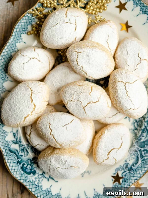 Italian Abbracci Chocolate and Cream Cookies 6 An overhead shot of Ricciarelli almond cookies on a plate
