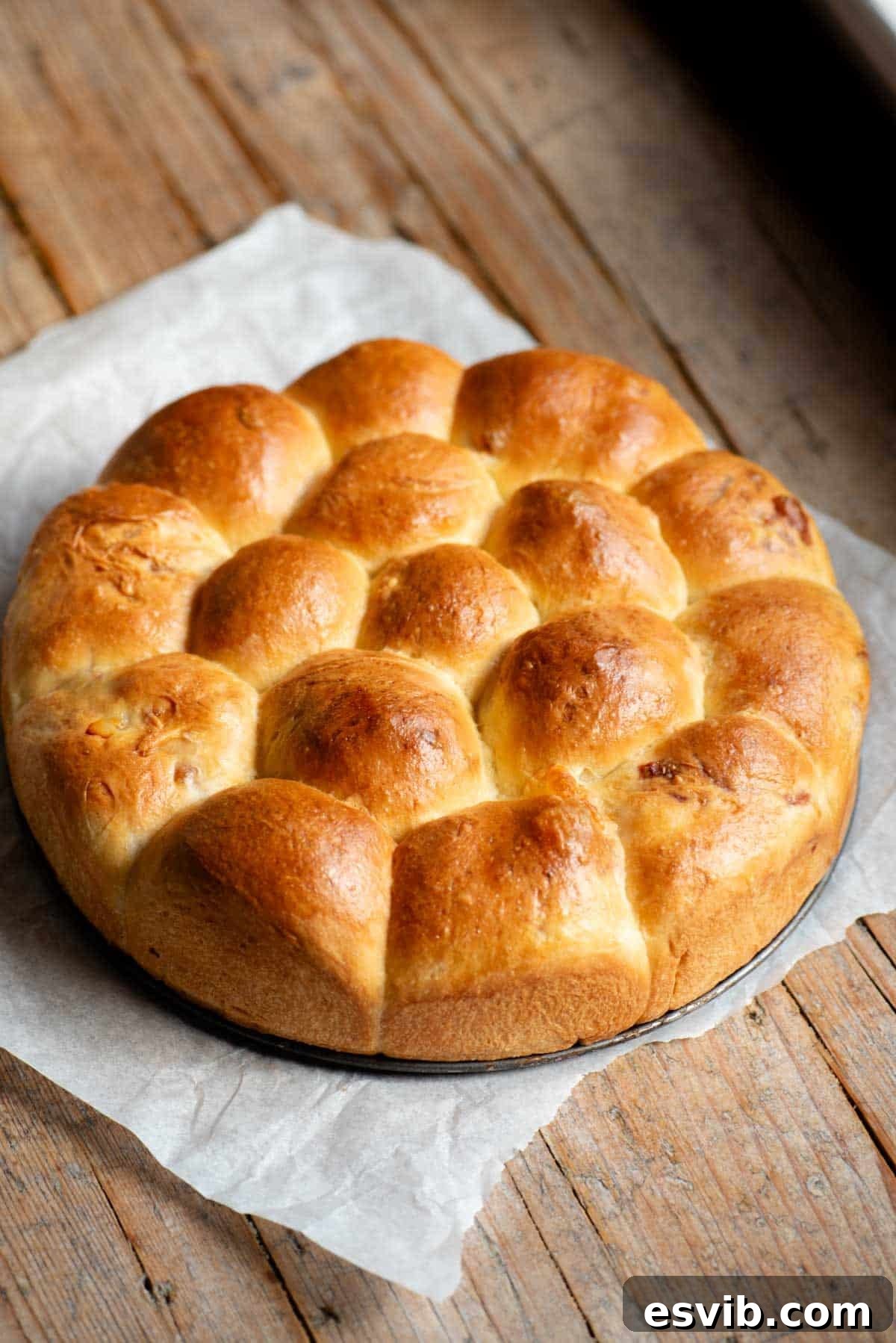 Neapolitan Danubio: Savory Stuffed Brioche Buns 2 A neapolitan brioche bread (danubio salato) sitting on a rustic wooden surface.