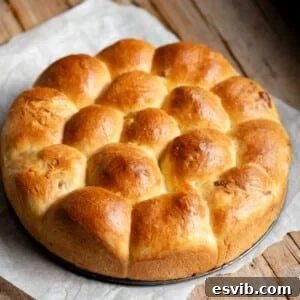 Neapolitan Danubio: Savory Stuffed Brioche Buns 9 A cropped square image of a danubio salato on a rustic wooden surface.